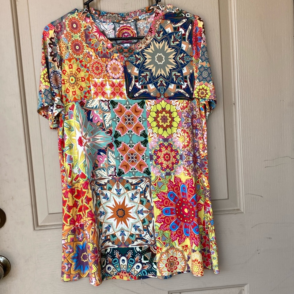 Johnny was women’s size medium soft colorful blouse like new